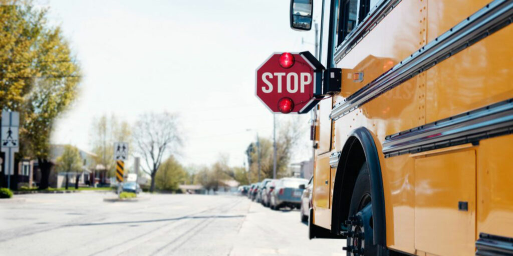 School bus stopped in a neighborhood.